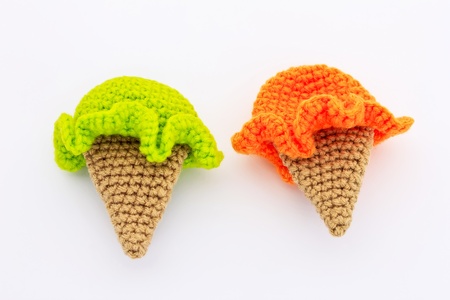 Cute ice cream crochet patterns in orange and green colorの写真素材