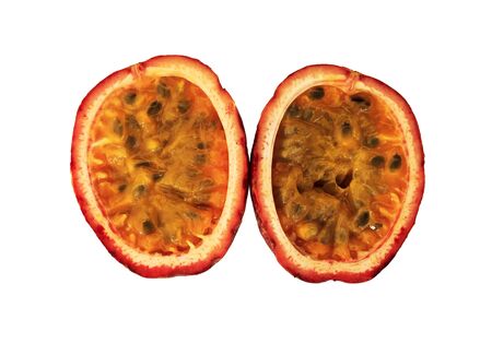 Passion fruit cut in half isolated on white background の写真素材
