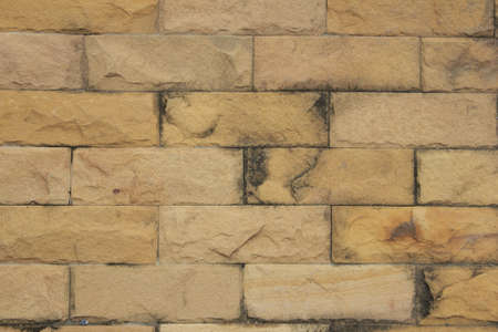 The ancient stone wall made of rectangular bricks  の写真素材