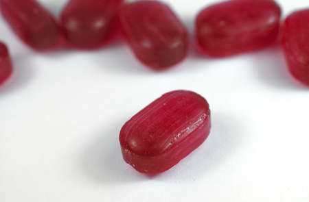 red pill on white background isolatedの写真素材