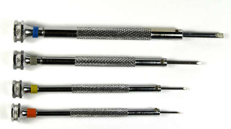 four horology screwdrivers on a white backgroundの写真素材