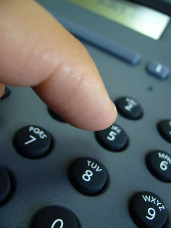 telephone keys and fingerの写真素材