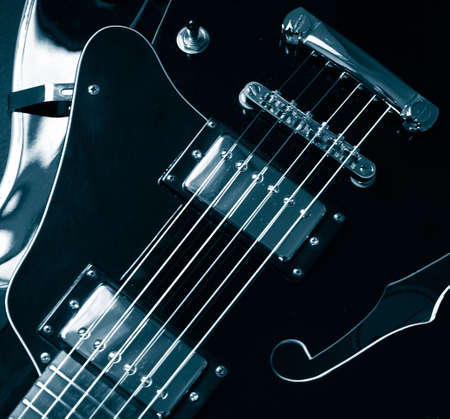 vintage jazz guitar detail monochrome in blue   の写真素材