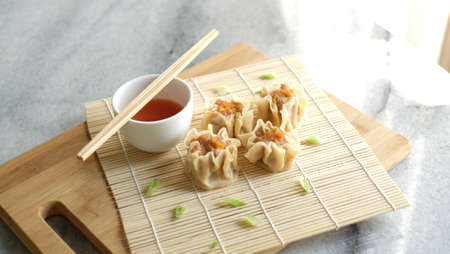 Chicken dum sum shumai with sauceの写真素材
