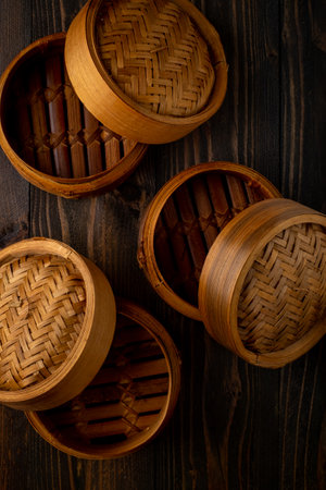 bamboo steamer on wooden backgroundの写真素材