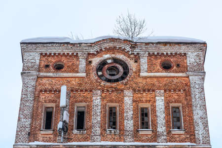 Old clock on the facade of the building. Monument of architecture Balashikha cotton-spinning factoryの写真素材