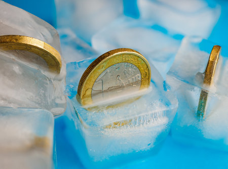 1 euro coins in ice cubesの写真素材