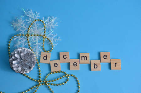 December month written in wooden letters on a blue background. The calendar. Winter.の写真素材