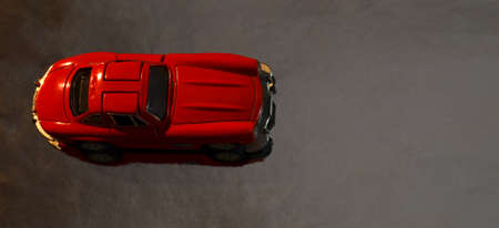 Red car on a gray background.