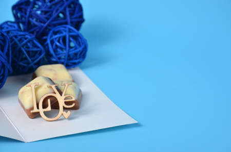 The inscription love on a blue background. Valentine's Day. The 14th of February. blue ballsの写真素材