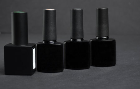 Gel polish on a black background close-up.の写真素材