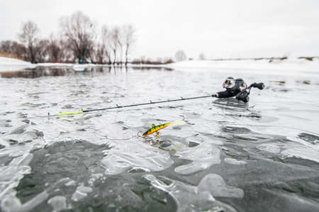 Ice fishing equipment on iceの写真素材