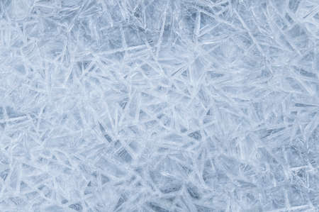 Frozen ice crystals. Simple white blue winter backgroundの写真素材