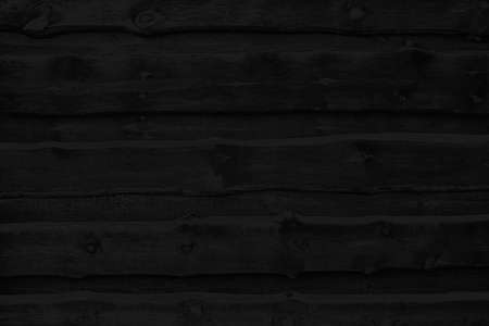 Black charcoal board, background of burnt wood texture.の写真素材