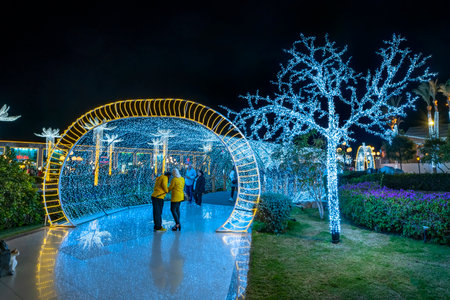 Sharm El Sheikh, Egypt - 22 Dec 2020: Colorful evening lighting of Soho square. Night festive illumination of New Year holiday.のeditorial素材