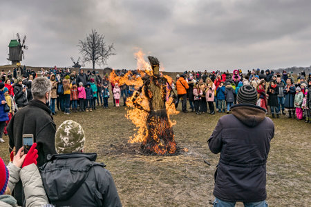 Kyiv, Pyrohiv Museum, Ukraine - 14 Mar 2021: Shrovetide Maslyana (Maslenica effigy). Burning straw scarecrow doll of Maslenitsa. Celebration winter end - traditional Slavic fest Belarus, Russiaのeditorial素材