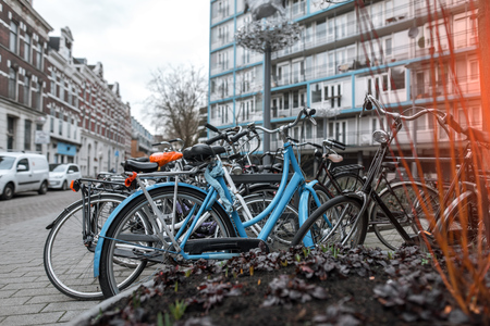 Many bicycles parked in a lockable area