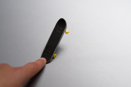 Finger mini skateboard toy on white background.の写真素材