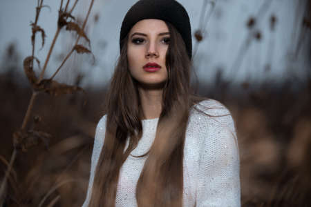 Portrait of hipster girl with black capの写真素材