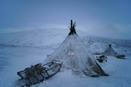 Old yurt of Siberia and sledge, cloudy day.の写真素材