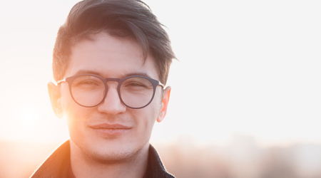 Close-up portrait of self-confident caucasian man at sunset.の写真素材