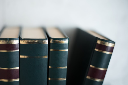 Close up of books over white background.