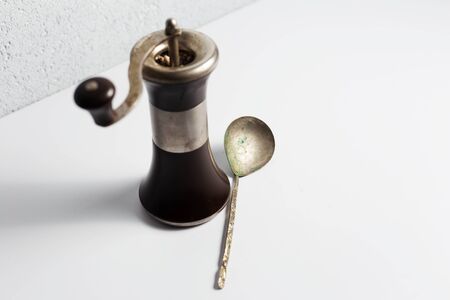Ancient pepper mill on white background.の写真素材