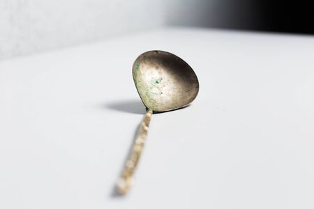 Ancient spoon on white background.の写真素材