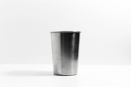 Close-up of steel cup isolated on white background.の写真素材