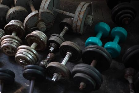 Close-up of many dumbbells stuff for gym.