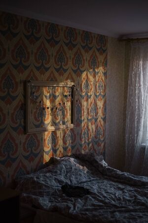 Cosy bedroom with sunlight shadowsの写真素材