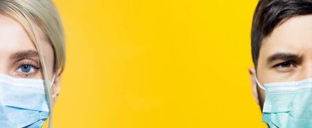 Collage of studio portraits of young girl and guy, half face. Wearing safety medical flu mask, coronavirus prevention. Isolated on yellow background with copy space.の写真素材