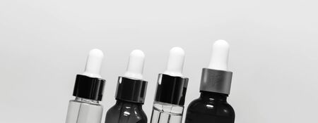 Close-up of different set of pipette bottles isolated on white background with copy space.の写真素材