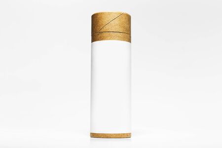 Close-up of cylinder cardboard box with empty sticker for mockup isolated on white studio background.の写真素材