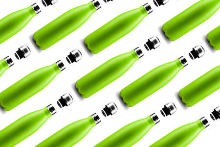 Bottle pattern. Set of eco colorful reusable steel thermo water bottles of green color, isolated on white background. Zero waste.の写真素材