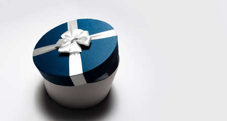 Top view of round half opened gift box isolated on white background with copy space.の写真素材