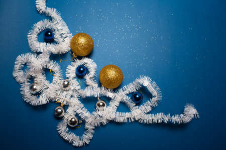 Top view of Christmas decoration and toys on blue background.の写真素材