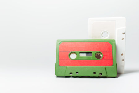 Close-up of two vintage music cassette on white background.の写真素材