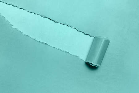 Torn paper with space for text, background of tidewater green color.の写真素材