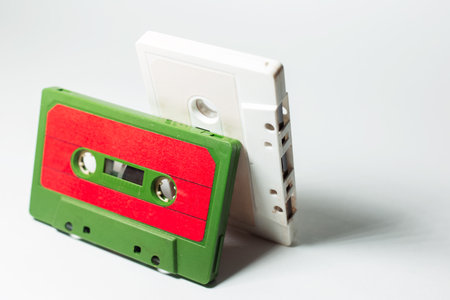 Close-up of two vintage music cassette on white background.