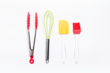Top view of colorful kitchen supplies set on background of white.の写真素材