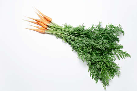 Natural view of fresh carrots on white background.の写真素材