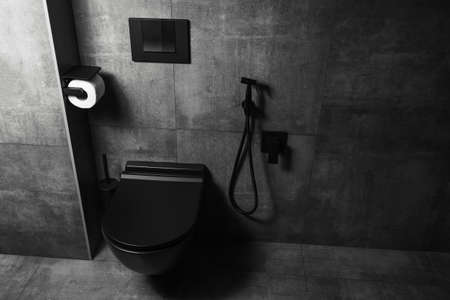 Photography of black matte bathroom details, with dark grey walls. WC area.の写真素材