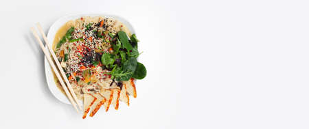 Studio photo of asian ramen noodles soup, with smoked tofu and mushrooms.