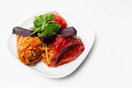 Homemade vegan food. Stuffed peppers with rice, mushrooms, served with rucola.の写真素材