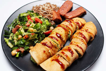 Vegan food. Baked rolls with tofu and mushrooms, seitan sausage and salad.の写真素材
