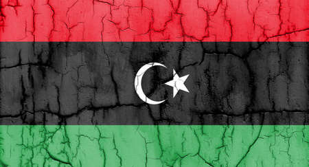 Textured photo of the flag of Libya with cracks.の写真素材