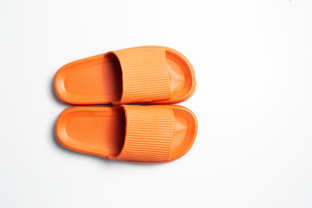 Top view of orange slippers isolated on white background. Summer concept.の写真素材