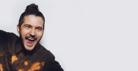 Studio portrait of happiness guy on white background with copy space.の写真素材