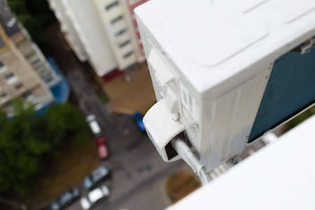 Close-up of pipe line to air conditioner exterior compressor.の写真素材